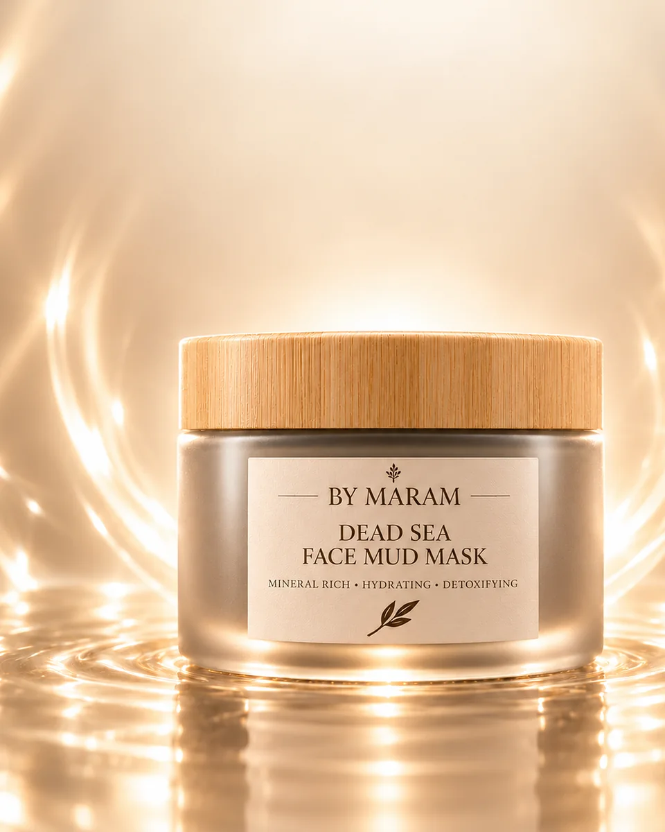Dead Sea Face Mud Mask: a frosted jar with a bamboo lid, standing in rings of light on water